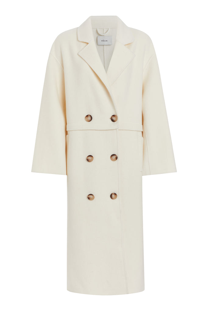 Bone EVELYN COAT This convertible coat features a low double breasted front with horn buttons and dropped shoulders. Purposefully designed oversized to allow for comfortable layering. Zipper above welt side pockets allows to double as a cropped jacket. 