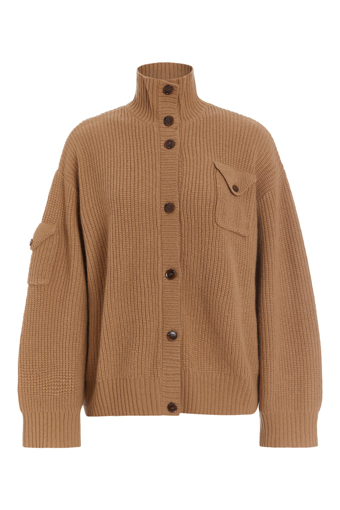 Creme Brulee Graham Cardigan This 100% royal cashmere cardigan features an oversized silhouette that hits below the hip, perfect for layering. Features horn buttons along with pockets at chest and right sleeve. Can be worn open or buttoned up as a turtleneck.