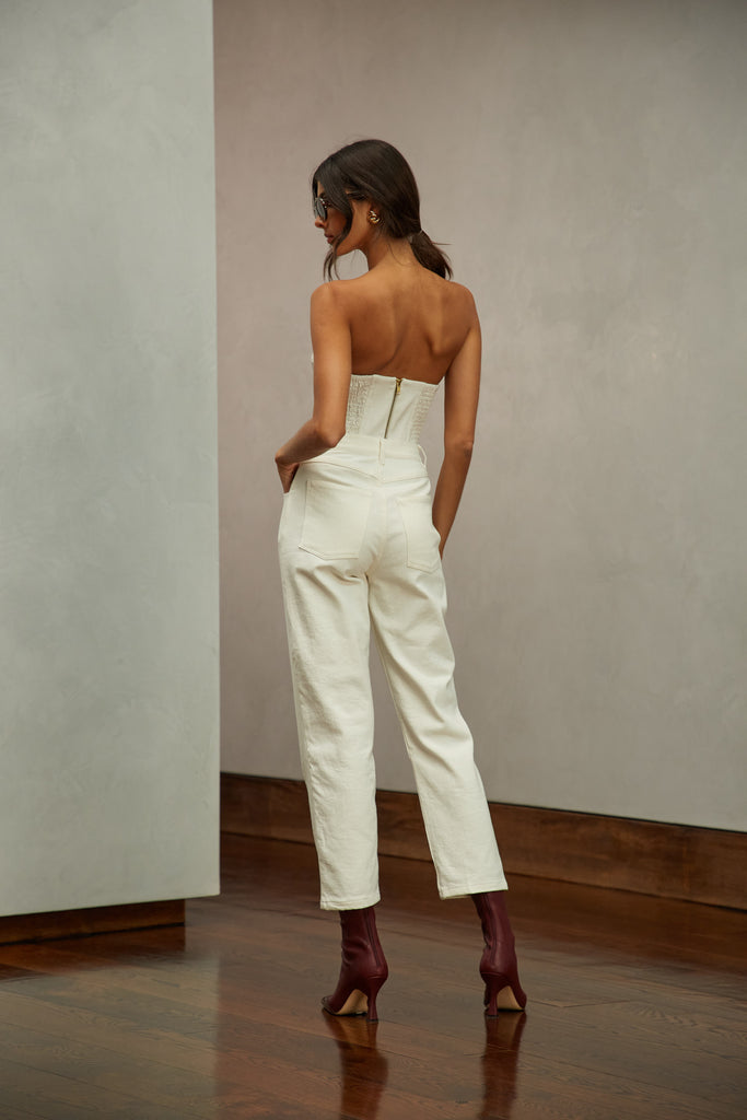 Bone Sarah Stretch Jean Vintage inspired high-rise fit with a relaxed straight-leg in a lightweight stretch denim, cropped ankle length and seams down the front. Each hand-finished pair has a branded enameled button. Made in New York.  Brittany is 5'10