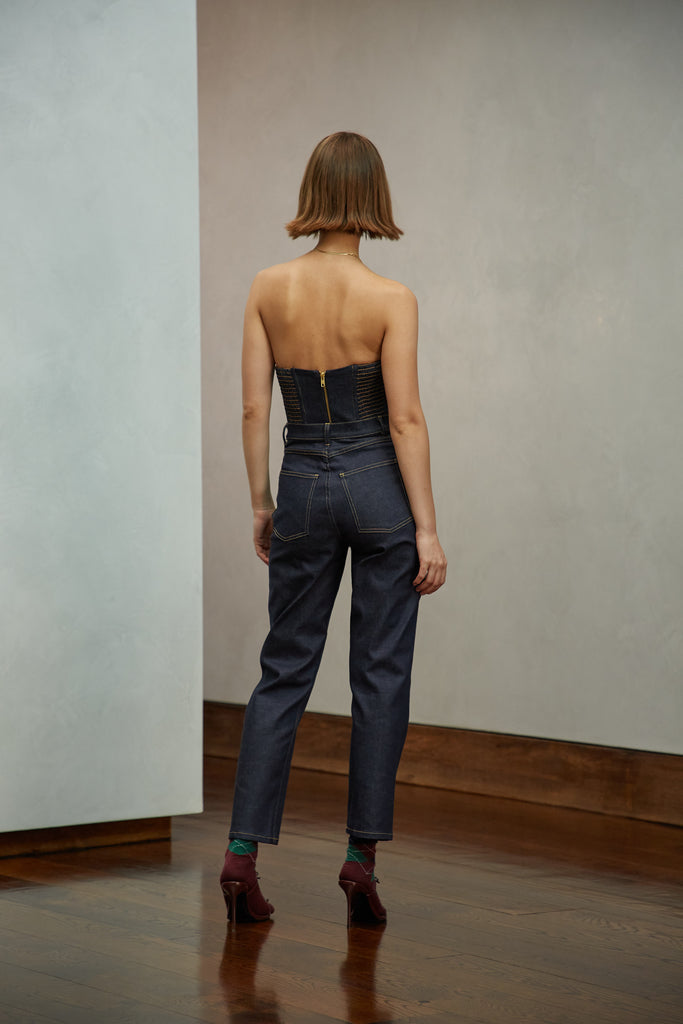 Raw Indigo Sarah Stretch Jean Vintage inspired high-rise fit with a relaxed straight-leg in a lightweight stretch denim, cropped ankle length and seams down the front. Each hand-finished pair has a branded enameled button. Made in New York.  Brittany is 5'10