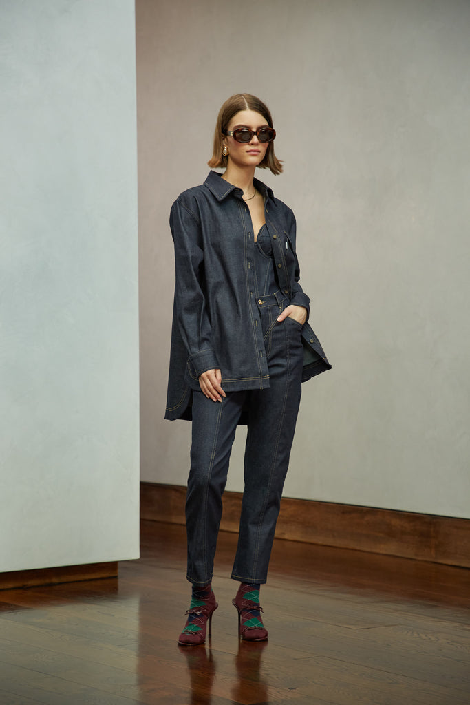 Raw Indigo Sarah Stretch Jean Vintage inspired high-rise fit with a relaxed straight-leg in a lightweight stretch denim, cropped ankle length and seams down the front. Each hand-finished pair has a branded enameled button. Made in New York.  Brittany is 5'10