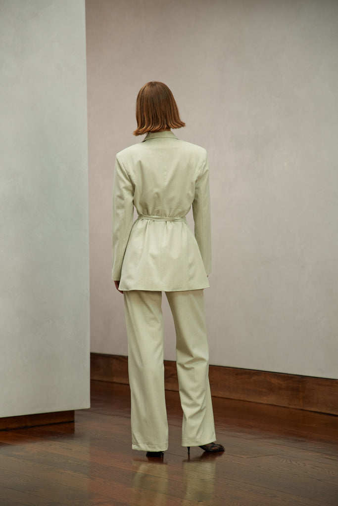 Sage Kat Trouser Dual pleated mid-rise trousers featuring a straight, relaxed fit. Pockets at back with horn buttons. Includes a self-fabric detachable belt. Style with The Rhodes Blazer  | Also available in BlackThis item is FINAL SALE.