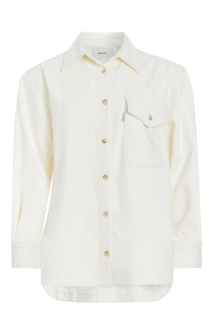 Bone Charlie Shirt This oversized button down is crafted from lightweight denim for a drapey yet structured silhouette. Its relaxed fit is finished with traditional denim stitching and horn buttons. Features a RŌARI branded deco label at chest pocket.