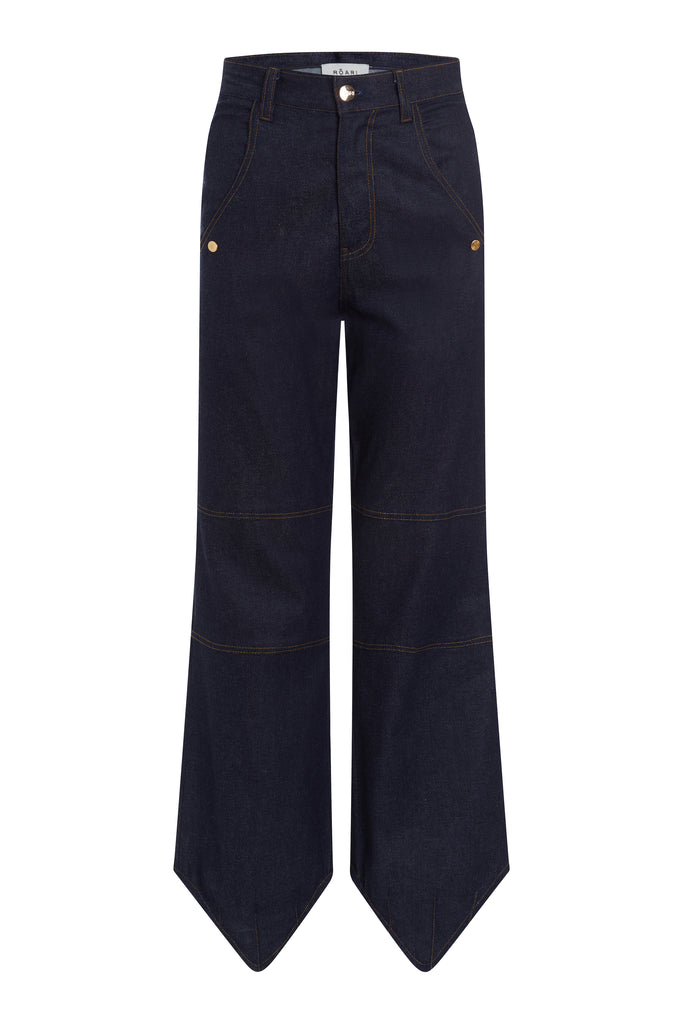 Raw Indigo Ronnie Trouser High-rise lightweight tailored trouser featuring contrasting waistband with self-fabric tie tunneled through two rows of belt loops. Featuring a relaxed leg fit with cargo style pockets and horn buttons.