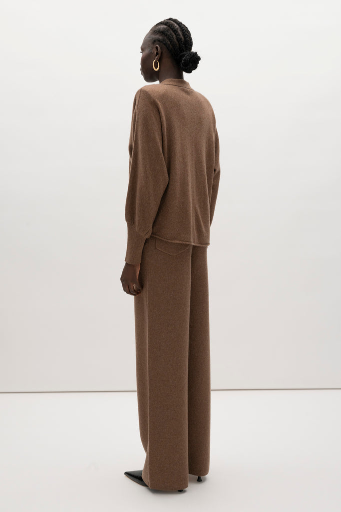 Brown Beverly Trouser Delicately soft and consciously crafted, a versatile piece designed for ultimate comfort.-Wide-leg silhouette for a relaxed fit-Elastic waistband-Center front pleats-Side pockets-Back patch pockets🐑 Made with Good Cashmere Standard® wool to support the welfare of cashmere goats We recommend ordering your usual size.Styled with the Nico Shirt