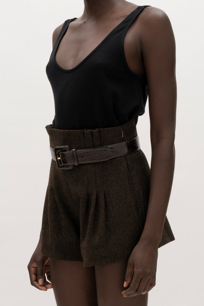 Brown Herringbone Kate Short Crafted with meticulous attention to detail for a sophisticated and contemporary look.-High-waisted paper bag short-On-seam pockets-Zip fly with hook and bar closure-Pleated front-Belt loops at back only, designed to keep your belt in place-Fully linedCrafted with Merino wool certified by the Wool Integrity Programme, ensuring farms adhere to the Five Freedoms of animal welfare. We recommend ordering your usual size.Styled with the Camilo Jacket & Zoey Tank
