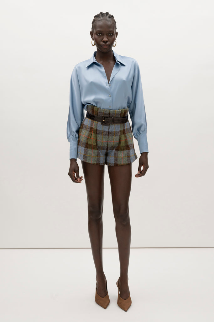 Sky Marna Shirt -Satin button front shirt with dolman sleeves-Structured collar with top and bottom edge stitching-Tailored cuffs with invisible side zippers-Removable self-covered shoulder pads-Finished with refined interior details and minimal visible stitching-Mother of pearl buttons-Wrinkle-resistant recycled satin We recommend ordering your usual size.Styled with the Kate Short