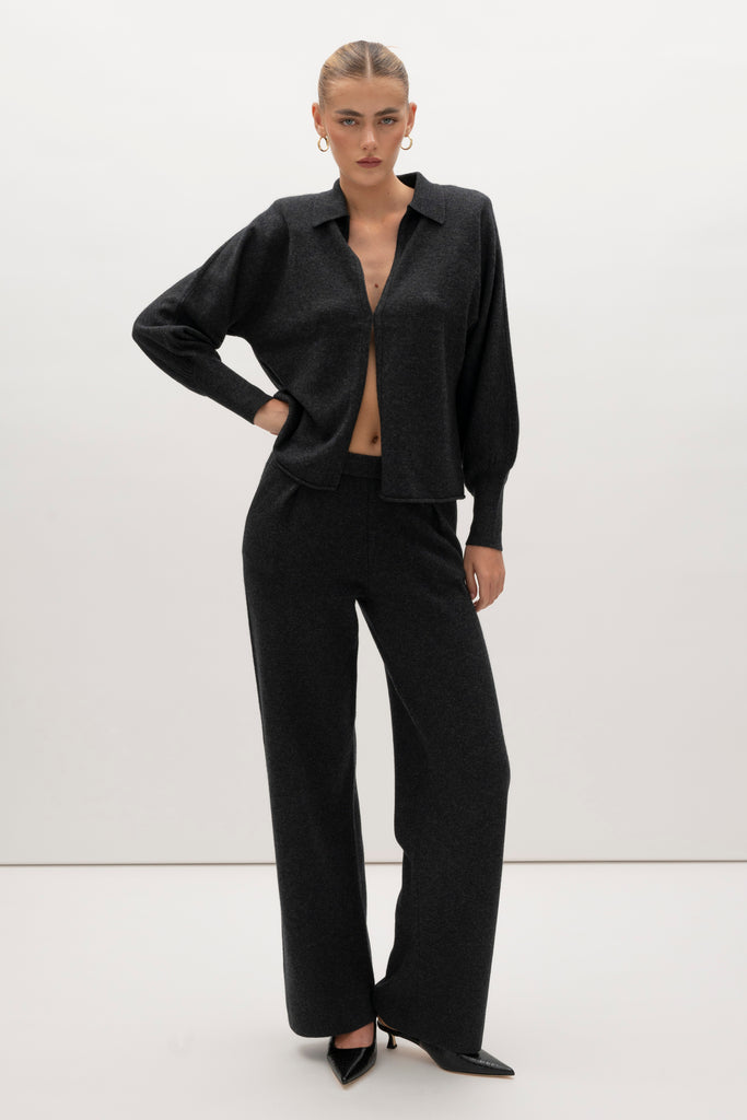 Charcoal Nico Shirt A seamless blend of soft comfort, style, and conscious sourcing, creating an essential you'll reach for again and again. -Collared open cardigan-Single hook and eye closure-Rib knit collar-Tailored ribbed cuffs-Dolman sleeves-Hip length-Rolled bottom hem-Self covered removable shoulder pads🐑 Made with Good Cashmere Standard® wool to support the welfare of cashmere goats We recommend ordering your usual size.Styled with the Beverly Trouser