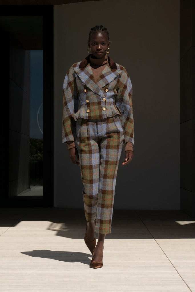 Green Multi Plaid Raymond Trouser Expertly tailored in a silhouette that echoes the collection's blend of classic tailoring and modern details.-100% British wool, handwoven in the Western Isles of Scotland-Straight leg ankle length trouser-Smooth velvet combo waistband-Double-pleated front-Slant front pockets-Self-doubled belt loops-Zip fly with hook and bar closure-Faux welt back pockets-Fully lined for superior comfort and drape♻️ Minimizing our environmental impact: Harris Tweed is naturally renewable, biodegradable and recyclable.We recommend ordering your usual size.Styled with the Raymond Jacket & Olivia Turtleneck 