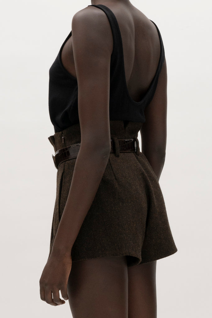 Brown Herringbone Kate Short Crafted with meticulous attention to detail for a sophisticated and contemporary look.-High-waisted paper bag short-On-seam pockets-Zip fly with hook and bar closure-Pleated front-Belt loops at back only, designed to keep your belt in place-Fully linedCrafted with Merino wool certified by the Wool Integrity Programme, ensuring farms adhere to the Five Freedoms of animal welfare. We recommend ordering your usual size.Styled with the Camilo Jacket & Zoey Tank