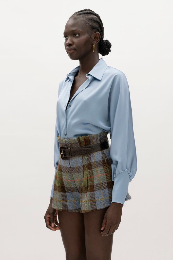 Sky Marna Shirt -Satin button front shirt with dolman sleeves-Structured collar with top and bottom edge stitching-Tailored cuffs with invisible side zippers-Removable self-covered shoulder pads-Finished with refined interior details and minimal visible stitching-Mother of pearl buttons-Wrinkle-resistant recycled satin We recommend ordering your usual size.Styled with the Kate Short