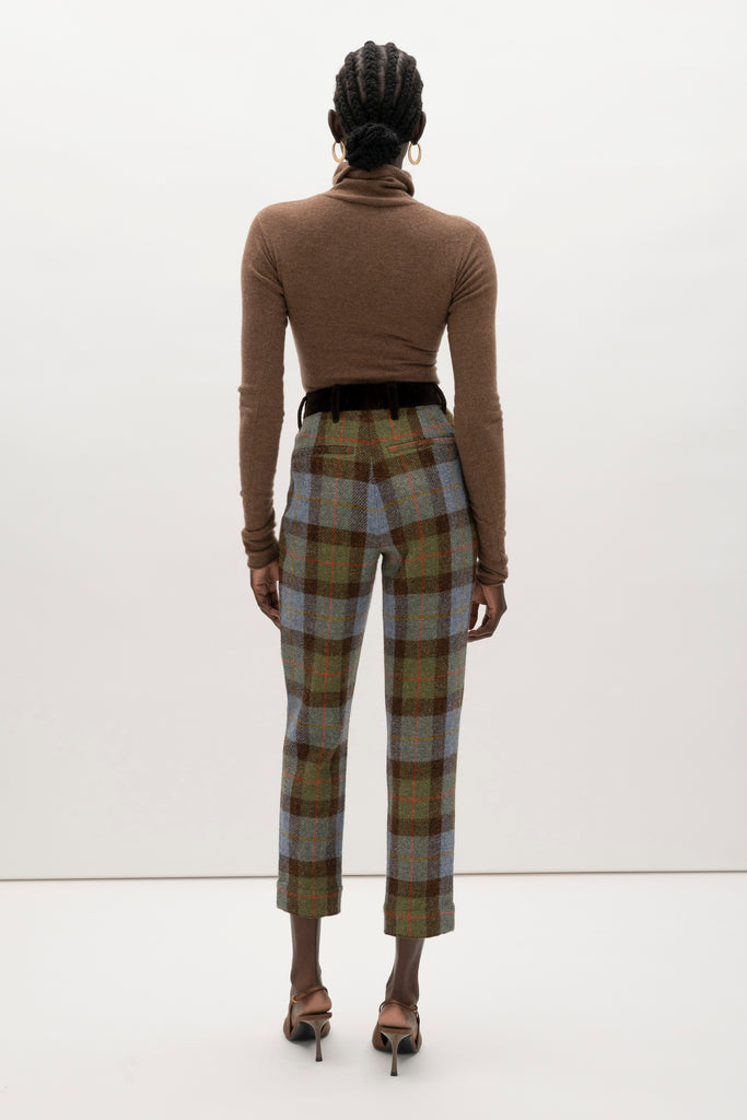 Green Multi Plaid Raymond Trouser Expertly tailored in a silhouette that echoes the collection's blend of classic tailoring and modern details.-100% British wool, handwoven in the Western Isles of Scotland-Straight leg ankle length trouser-Smooth velvet combo waistband-Double-pleated front-Slant front pockets-Self-doubled belt loops-Zip fly with hook and bar closure-Faux welt back pockets-Fully lined for superior comfort and drape♻️ Minimizing our environmental impact: Harris Tweed is naturally renewable, biodegradable and recyclable.We recommend ordering your usual size.Styled with the Raymond Jacket & Olivia Turtleneck 