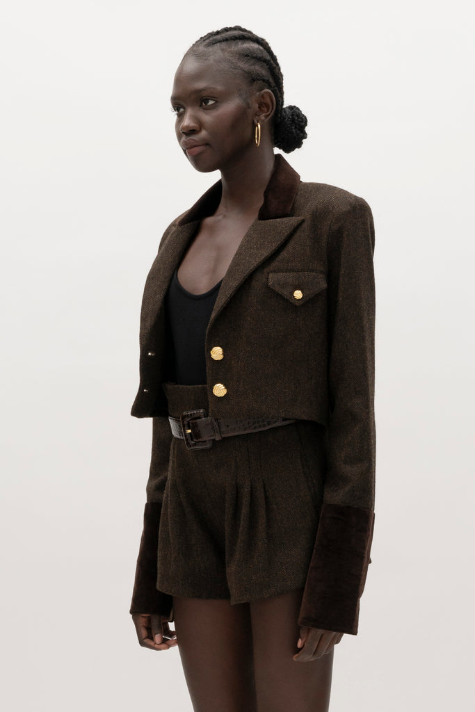 Brown Herringbone Kate Short Crafted with meticulous attention to detail for a sophisticated and contemporary look.-High-waisted paper bag short-On-seam pockets-Zip fly with hook and bar closure-Pleated front-Belt loops at back only, designed to keep your belt in place-Fully linedCrafted with Merino wool certified by the Wool Integrity Programme, ensuring farms adhere to the Five Freedoms of animal welfare. We recommend ordering your usual size.Styled with the Camilo Jacket & Zoey Tank