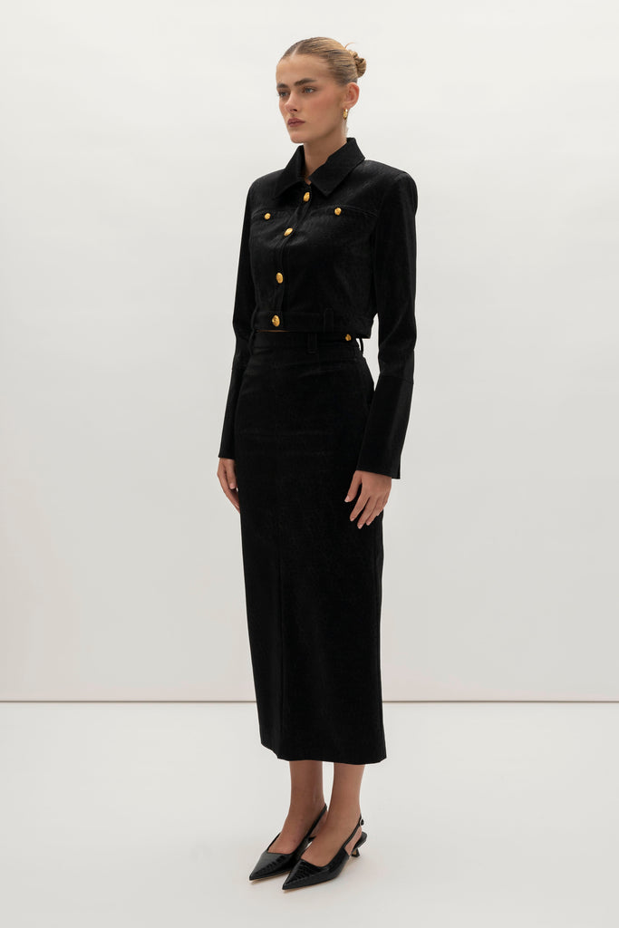 Black Ostrich Meredith Jacket A fresh take on the classic suit jacket, this faux ostrich piece features ROARI's signature gold knot buttons at center front, welt pockets and cuffs. Fully lined.We recommend ordering your usual size.Styled with the Meredith Skirt