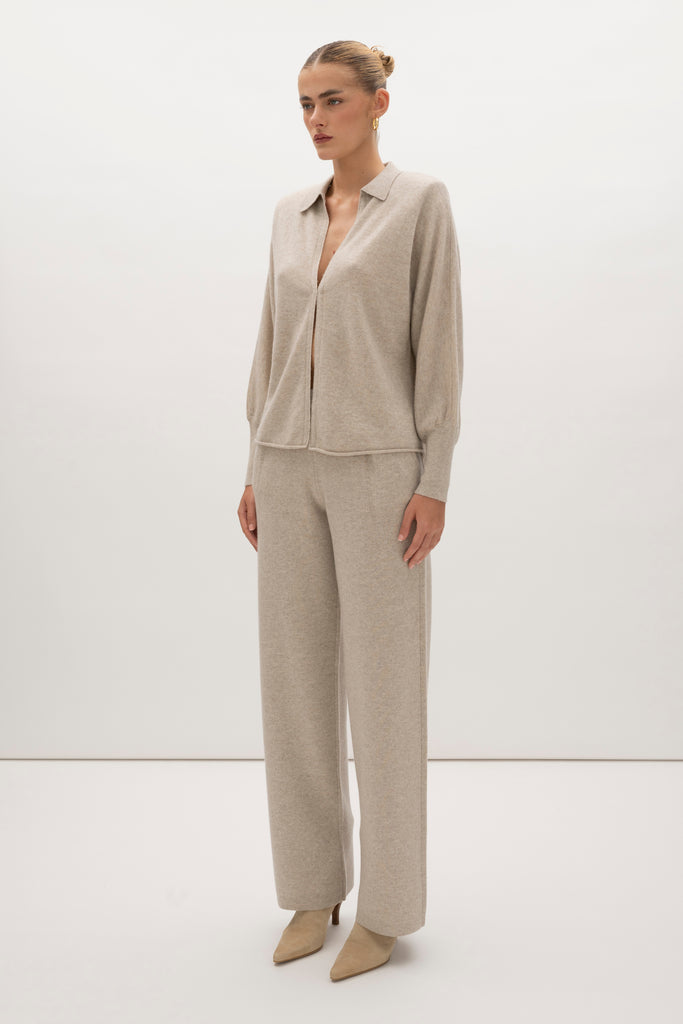 Oatmeal Nico Shirt A seamless blend of soft comfort, style, and conscious sourcing, creating an essential you'll reach for again and again. -Collared open cardigan-Single hook and eye closure-Rib knit collar-Tailored ribbed cuffs-Dolman sleeves-Hip length-Rolled bottom hem-Self covered removable shoulder pads🐑 Made with Good Cashmere Standard® wool to support the welfare of cashmere goats We recommend ordering your usual size.Styled with the Beverly Trouser