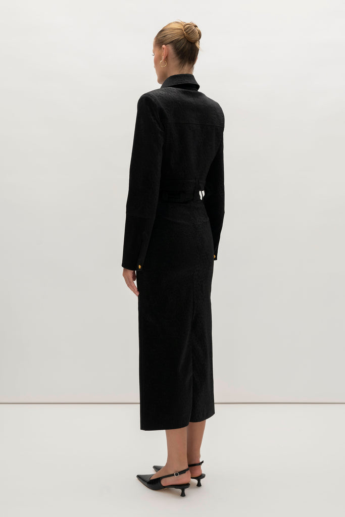 Black Ostrich Meredith Jacket A fresh take on the classic suit jacket, this faux ostrich piece features ROARI's signature gold knot buttons at center front, welt pockets and cuffs. Fully lined.We recommend ordering your usual size.Styled with the Meredith Skirt