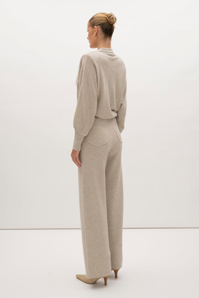 Oatmeal Beverly Trouser Delicately soft and consciously crafted, a versatile piece designed for ultimate comfort.-Wide-leg silhouette for a relaxed fit-Elastic waistband-Center front pleats-Side pockets-Back patch pockets🐑 Made with Good Cashmere Standard® wool to support the welfare of cashmere goats We recommend ordering your usual size.Styled with the Nico Shirt