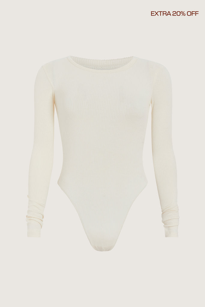 Bone Baby Bodysuit This buttery soft long sleeved bodysuit features a sleek silhouette with a crew neckline and an asymmetrical bold back cutout.Fits true to size. Size down if you prefer an even more snug fit.*FINAL SALE. Please reference our return & exchange policy for Bodysuits. Extra 20% off auto-applied in cart.