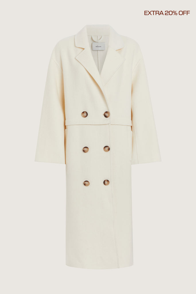  Evelyn Coat -Double-breasted cashmere blend two-way coat -Fully convertible - top and bottom panels zip apart for versatile wear-Internal hidden zipper finished with satin binding-Double-faced fabric construction -Functional flap pockets with flipped shape and reinforced finish-Intentional oversized fit made for layering-Horn button closure -Back ventAnok is 5'9