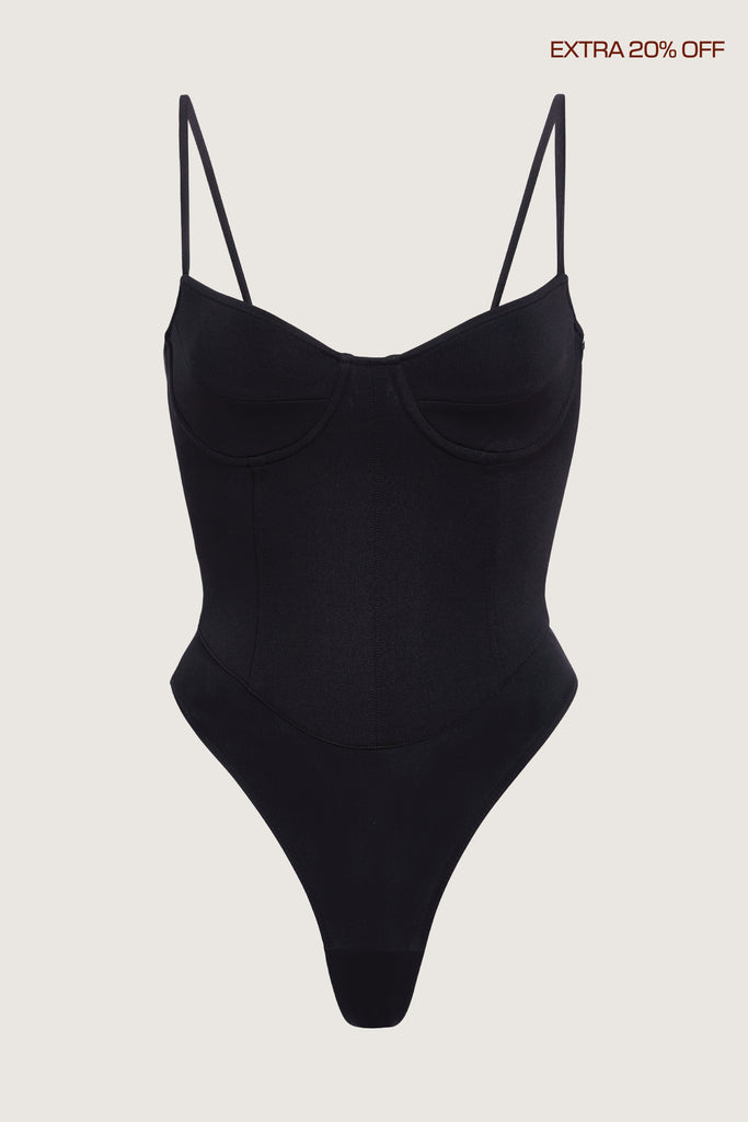 Black Lily Bodysuit This shape enhancing thong bodysuit is designed as the perfect base layer.Fits true to size. Model is 5'10