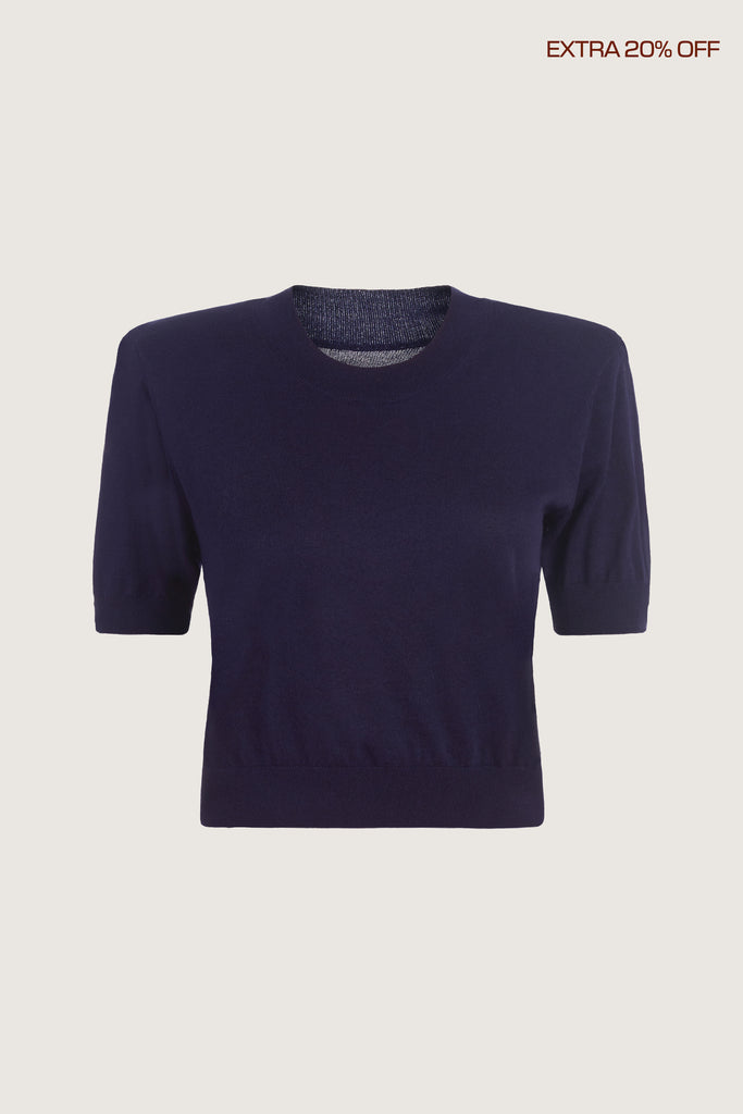  Margot SS Sweater -Crewneck short sleeve sweater -Crafted in a lightweight silk and cashmere blend -Single-layer ribbing at neckline, cuffs, and hem-Subtle shoulder structure with removable, self-covered shoulder pads-Interior shoulder seam with discreet snaps to remove pads Ingryd is 5'10