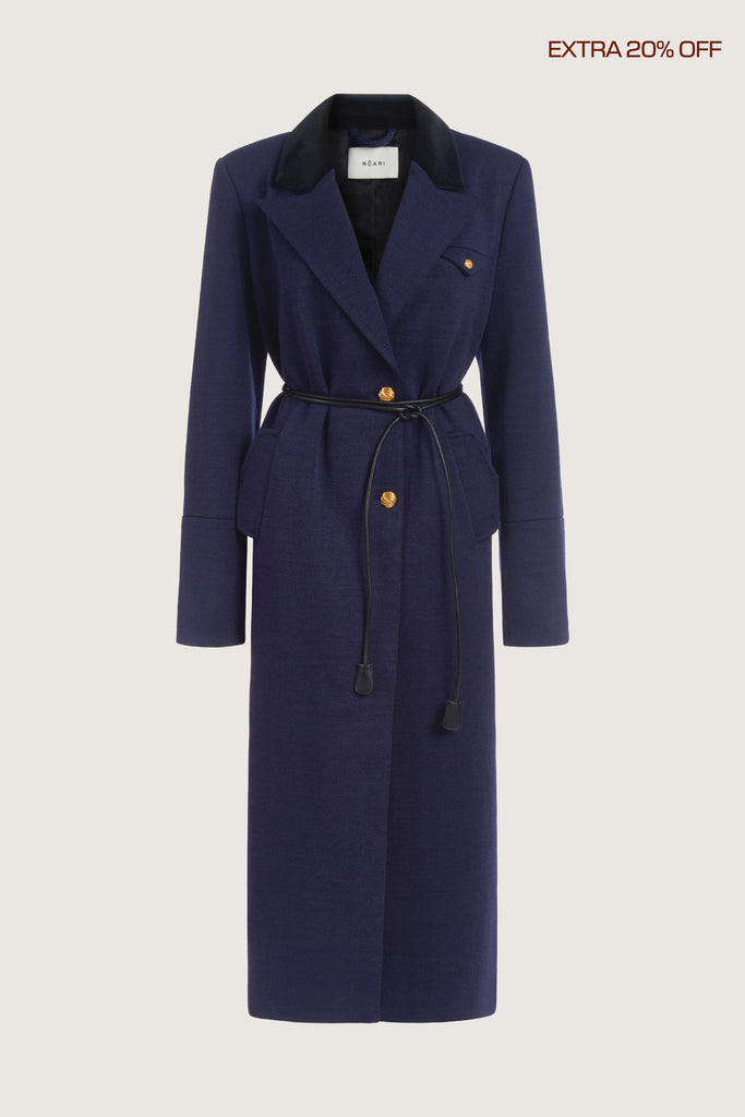  Meredith Coat This single breasted Italian wool coat is highlighted with contrasting velvet details at the collar and cuffs, providing multiple styling possibilities. It includes a 100% lambskin wrap belt and features double side vents for enhanced comfort. It is finished with ROARI's signature gold knot buttons. Fully lined. Molly is 5'9