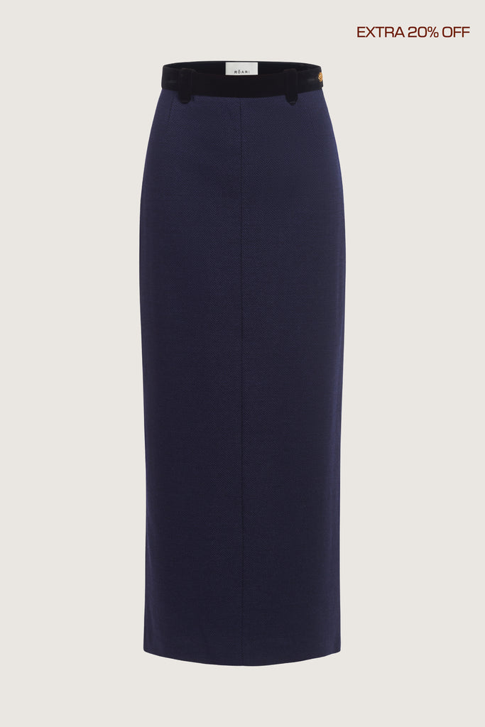  Meredith Skirt A fresh take on the classic pencil skirt, this style is crafted with fine Italian virgin wool. Detailed contrasting velvet at waist and finished with ROARI's signature gold knot button at left hip. Fully lined.Molly is 5’9” and wearing a size XXS.Styled with the Meredith Jacket & Meredith Coat*FINAL SALE. Please reference our return & exchange policy here.Extra 20% off auto-applied in cart.