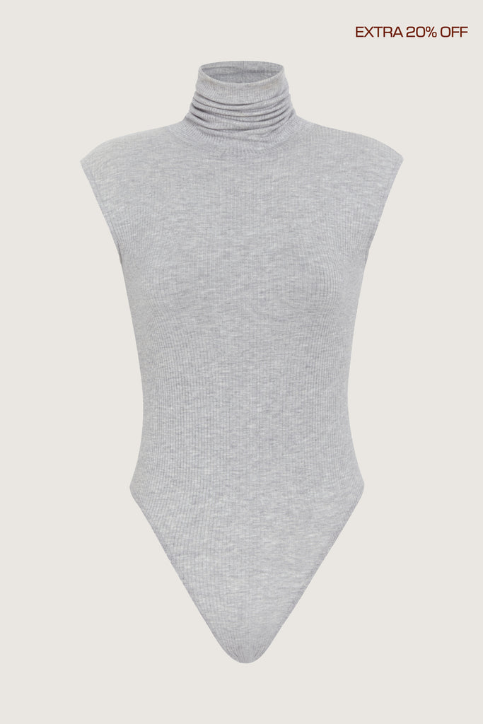 Light Grey Penny Bodysuit This buttery soft sleeveless ribbed turtleneck bodysuit showcases a sleek silhouette for a versatile wardrobe staple.Fits true to size. Size down for an even more snug fit.*FINAL SALE. Please reference our return & exchange policy for Bodysuits.Extra 20% off auto-applied in cart.