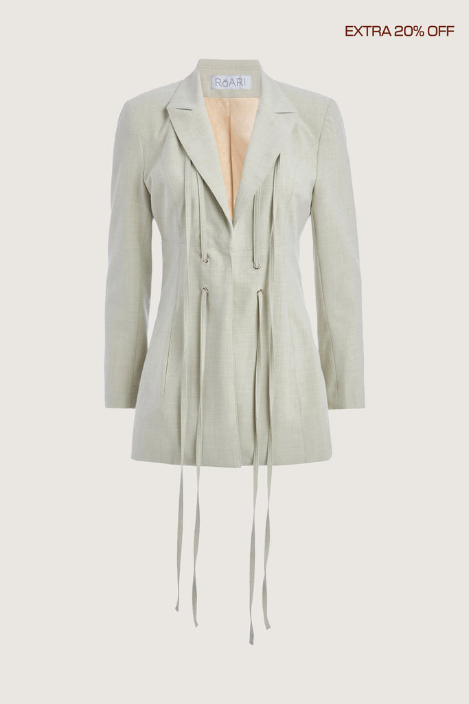 Sage Rhodes Blazer This mid-length blazer features a detachable waist tie, allowing you to create a range of looks. The tailored single- breasted style features shoulder pads and front welt pockets. The Kat Trouser compliments the blazer perfectly.Ana is 5’9