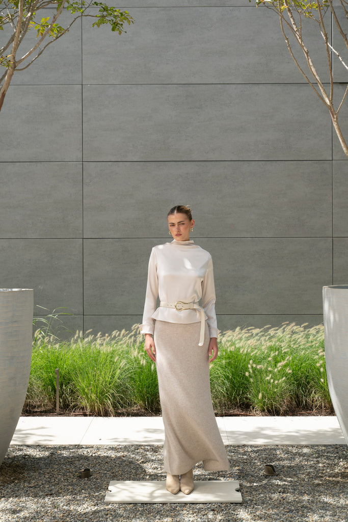 Oatmeal Ava Skirt Delicately soft and consciously crafted, the perfect foundation for creating effortless looks.-Classic maxi skirt silhouette-Full length-Slit at center back-Elastic waistband 🐑 Made with Good Cashmere Standard® wool to support the welfare of cashmere goats We recommend ordering your usual size.Styled with the Olivia Turtleneck & Vivien LS Top