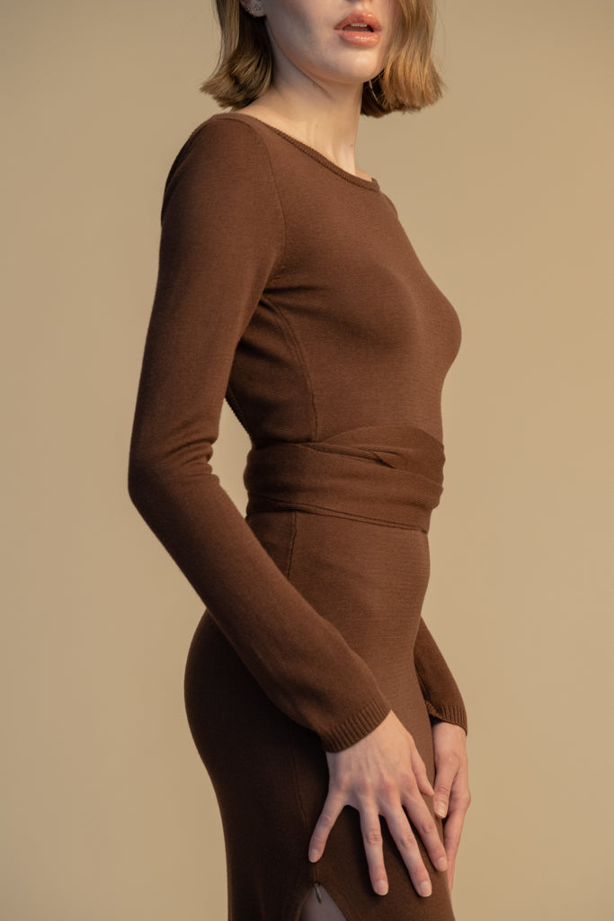 Chocolate BAMBI KNIT DRESS This wrap dress features a fixed belt at waist and plunging open back. Crafted from a luxe cashmere blend, hidden zips at sides provide option to vent. Size down for a snug fit. 