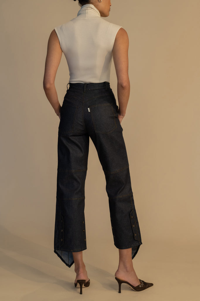 Bone PENNY BODYSUIT This buttery soft sleeveless ribbed turtleneck bodysuit showcases a sleek silhouette for a versatile wardrobe staple. 