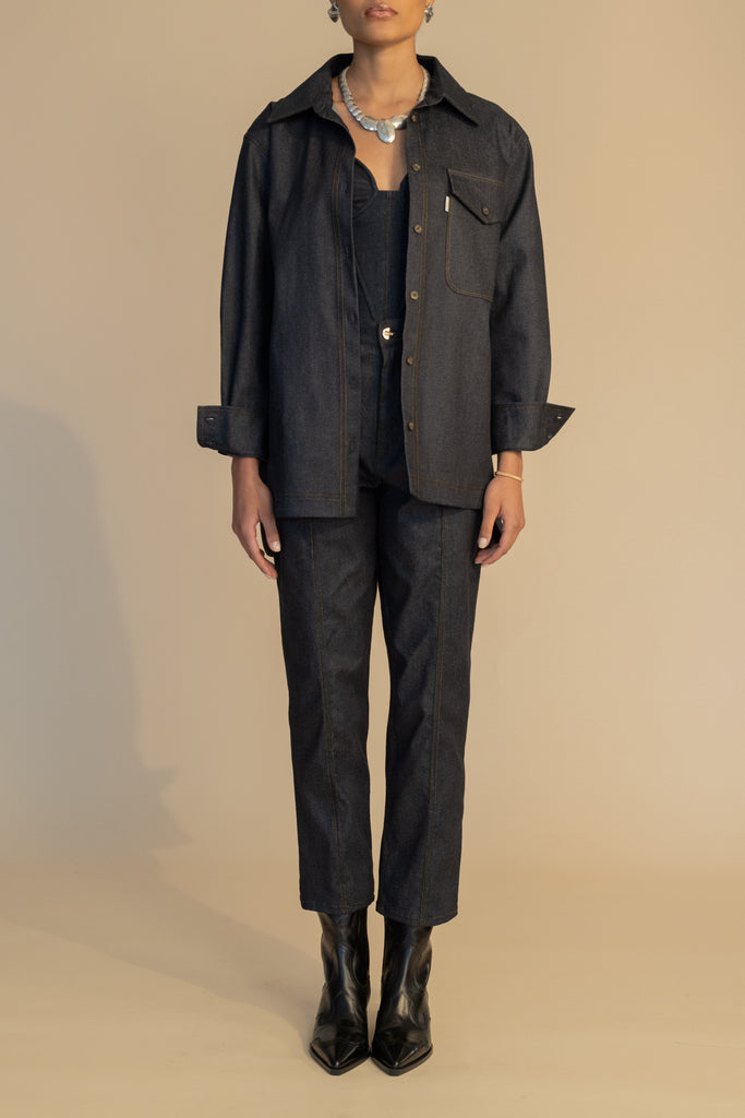 Raw Indigo Sarah Stretch Jean Vintage inspired high-rise jean with a relaxed straight-leg, cropped ankle length and seams down the front. Each hand-finished pair has a branded enameled button. Made in New York. 