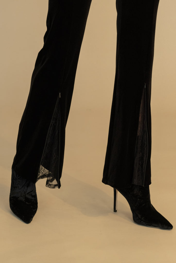 Black ROSE PANT High-rise straight-leg velvet pant featuring hidden zips at front for option to reveal a lace flared silhouette. 