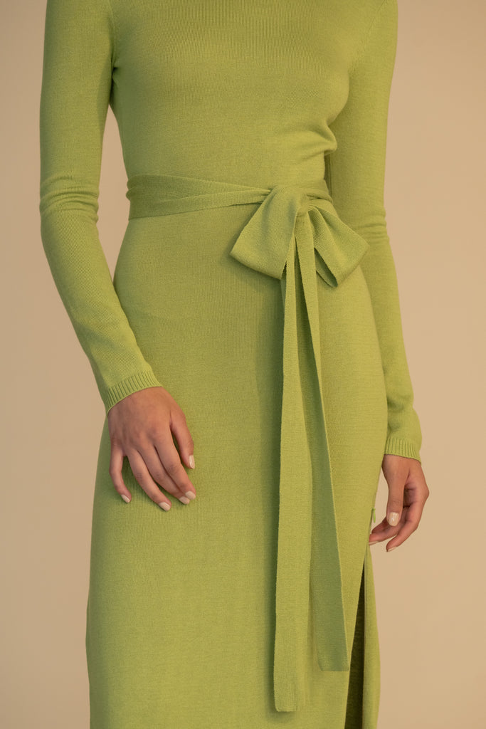 Leaf BAMBI KNIT DRESS This wrap dress features a fixed belt at waist and plunging open back. Crafted from a luxe cashmere blend, hidden zips at sides provide option to vent. Size down for a snug fit. 