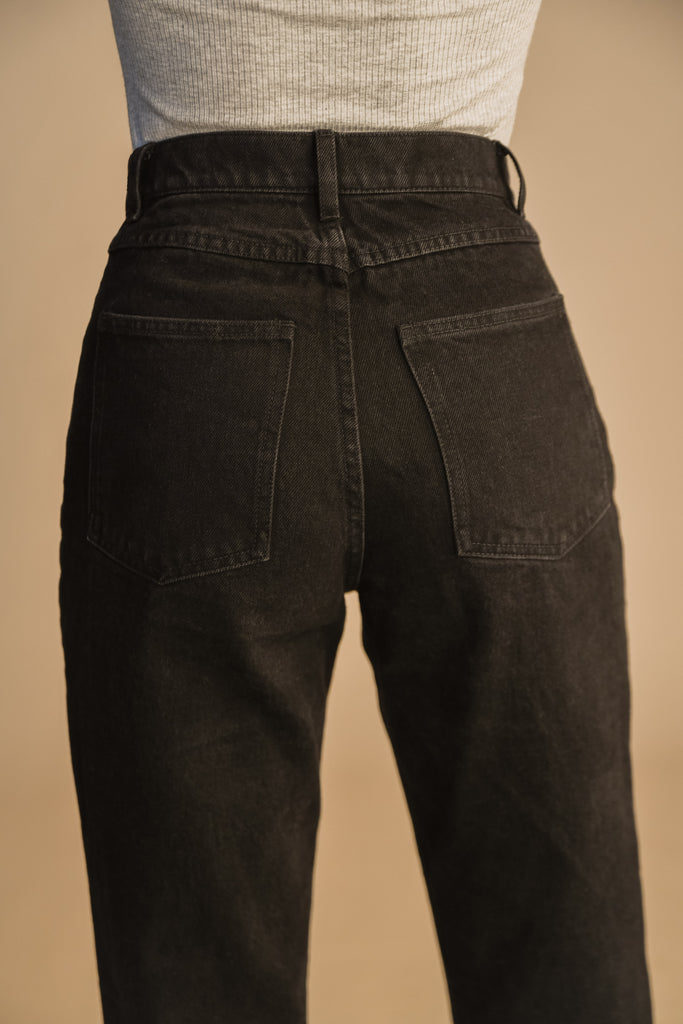 Faded Black SARAH JEAN Vintage inspired high-rise jean with a relaxed straight-leg, cropped ankle length and seams down the front. Each hand-finished pair has a branded enameled button. 100% cotton. Made in New York. *Due to the nature of this custom wash we suggest sizing up 1-2 sizes.