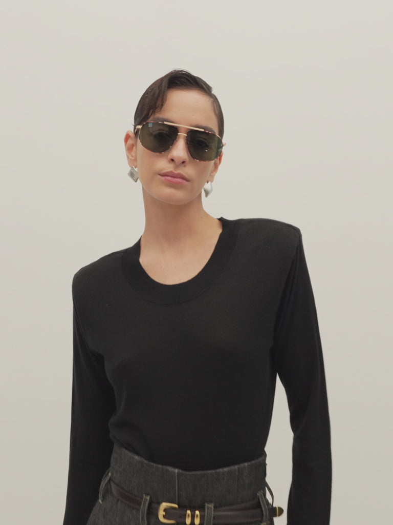 Black Margot LS Sweater -Crewneck long sleeve sweater -Crafted in a lightweight silk and cashmere blend -Single-layer ribbing at neckline, cuffs, and hem-Subtle shoulder structure with removable, self-covered shoulder pads-Interior shoulder seam with discreet snaps to remove pads  Ingryd is 5'10