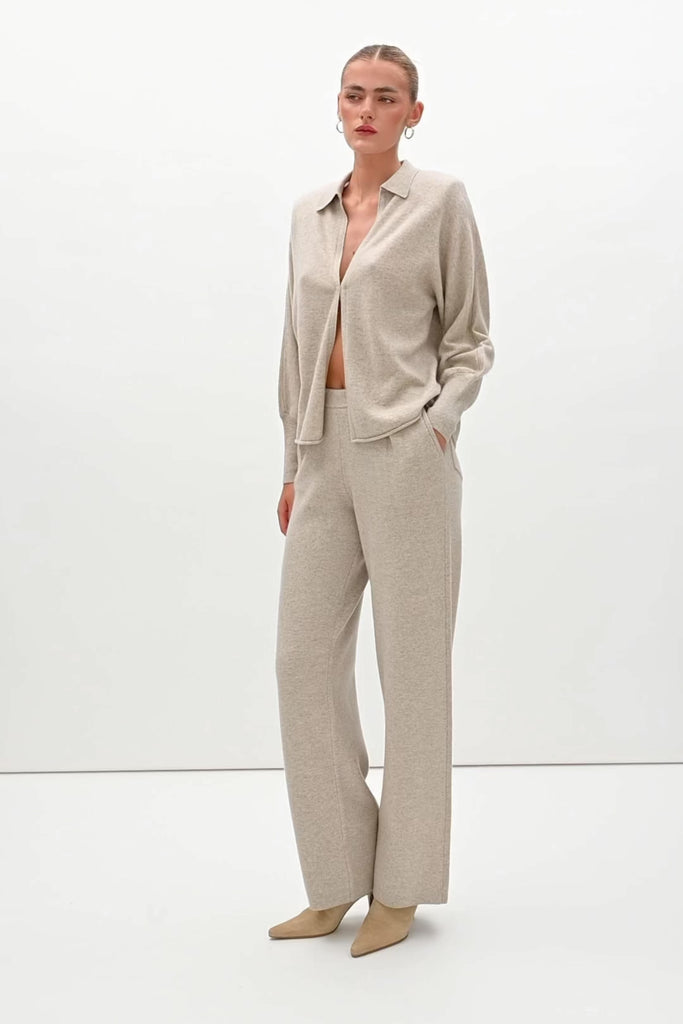 Oatmeal Nico Shirt A seamless blend of soft comfort, style, and conscious sourcing, creating an essential you'll reach for again and again. -Collared open cardigan-Single hook and eye closure-Rib knit collar-Tailored ribbed cuffs-Dolman sleeves-Hip length-Rolled bottom hem-Self covered removable shoulder pads🐑 Made with Good Cashmere Standard® wool to support the welfare of cashmere goats We recommend ordering your usual size.Styled with the Beverly Trouser