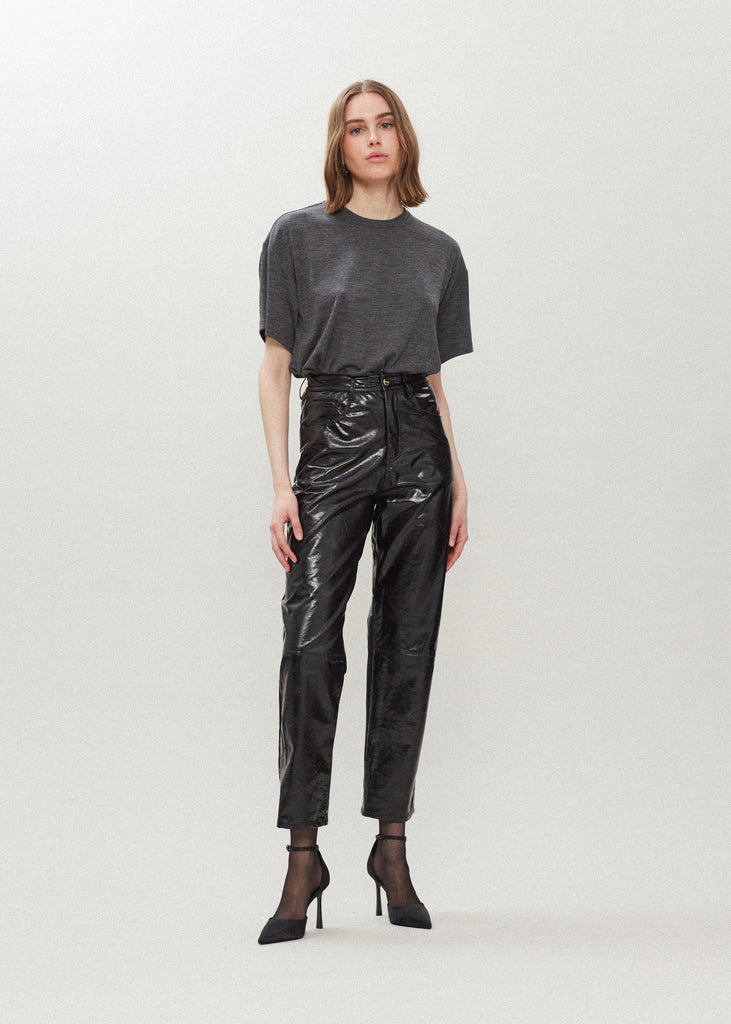 Black Ashley Pant Crafted from premium vegan leather, these pants are designed with a high-rise waist and a straight-cut silhouette. Each hand-finished pair has a branded enameled button.