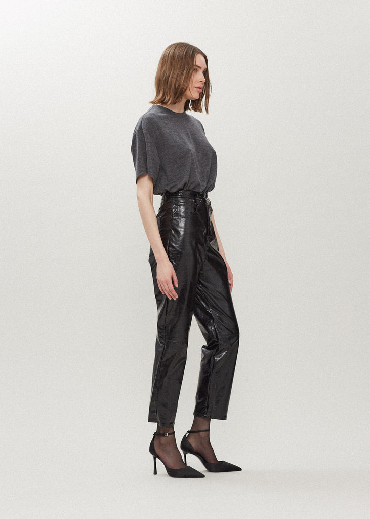 Black Ashley Pant Crafted from premium vegan leather, these pants are designed with a high-rise waist and a straight-cut silhouette. Each hand-finished pair has a branded enameled button.