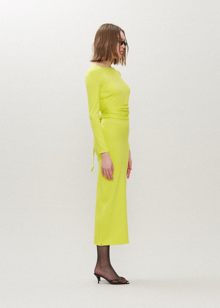 Lime Punch Bambi Dress This wrap dress features a fixed belt at waist and plunging open back. Crafted from a stretch ponte fabric, hidden zips at sides provide option to vent. Size down for a snug fit.*Sale merchandise is exchangeable for size/color or store credit. 