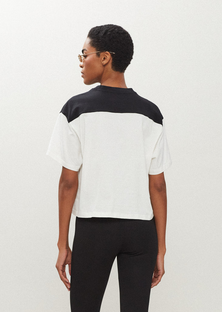 Black/White Branded Danny Tee An oversized drop shoulder t-shirt made from 100% lightweight cotton featuring felt appliqué RŌARI branding. Cut with a semi-cropped boxy fit.