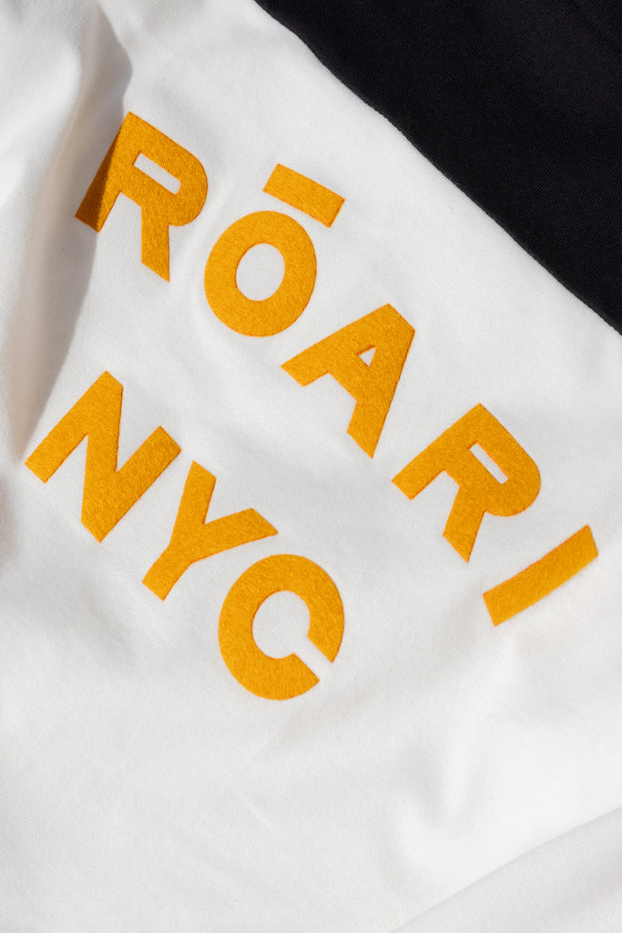 Black/White Archive / Branded Danny Tee An oversized drop shoulder t-shirt made from 100% lightweight cotton featuring felt appliqué ROARI branding. Cut with a semi-cropped boxy fit. *Please reference our return & exchange policy for Sale & Archived items.