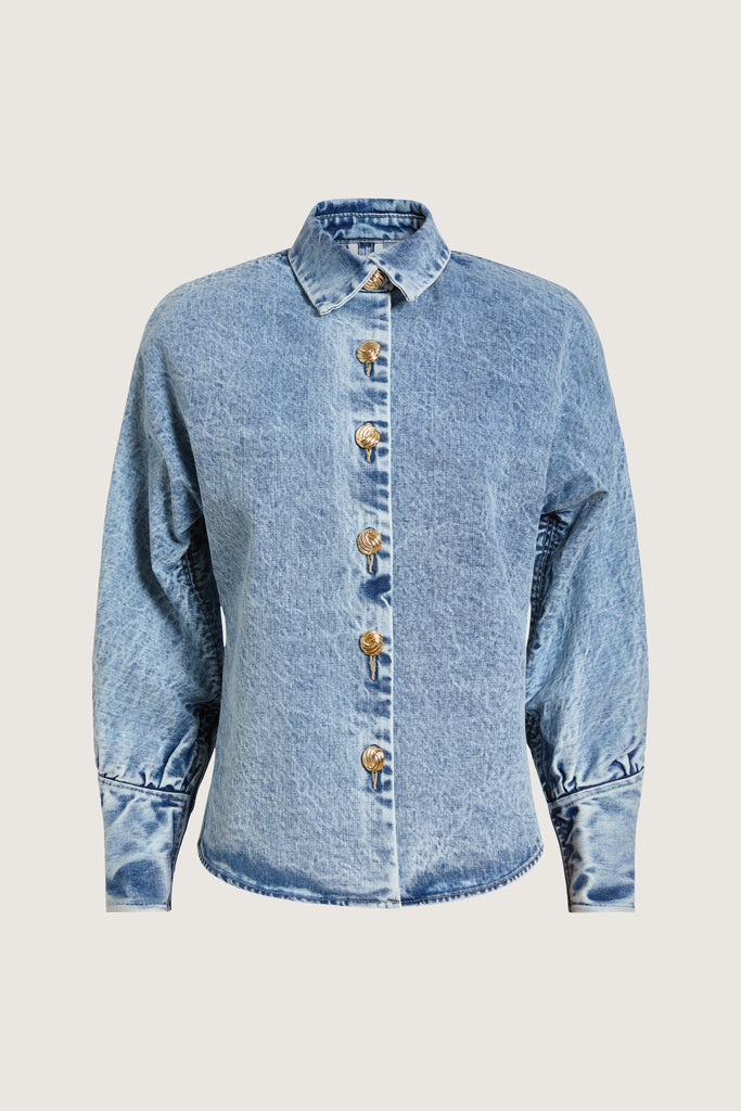 Light Indigo Jane Shirt -Dolman sleeves -Sculpted cuffs with invisible back zippers-Bound seams for durability-5-button front placket with ROARI gold knot buttons-Structured collar stand-Removable shoulder pads with snaps-Custom washed for lived-in look-ROARI gold knot buttons Anok is 5'9