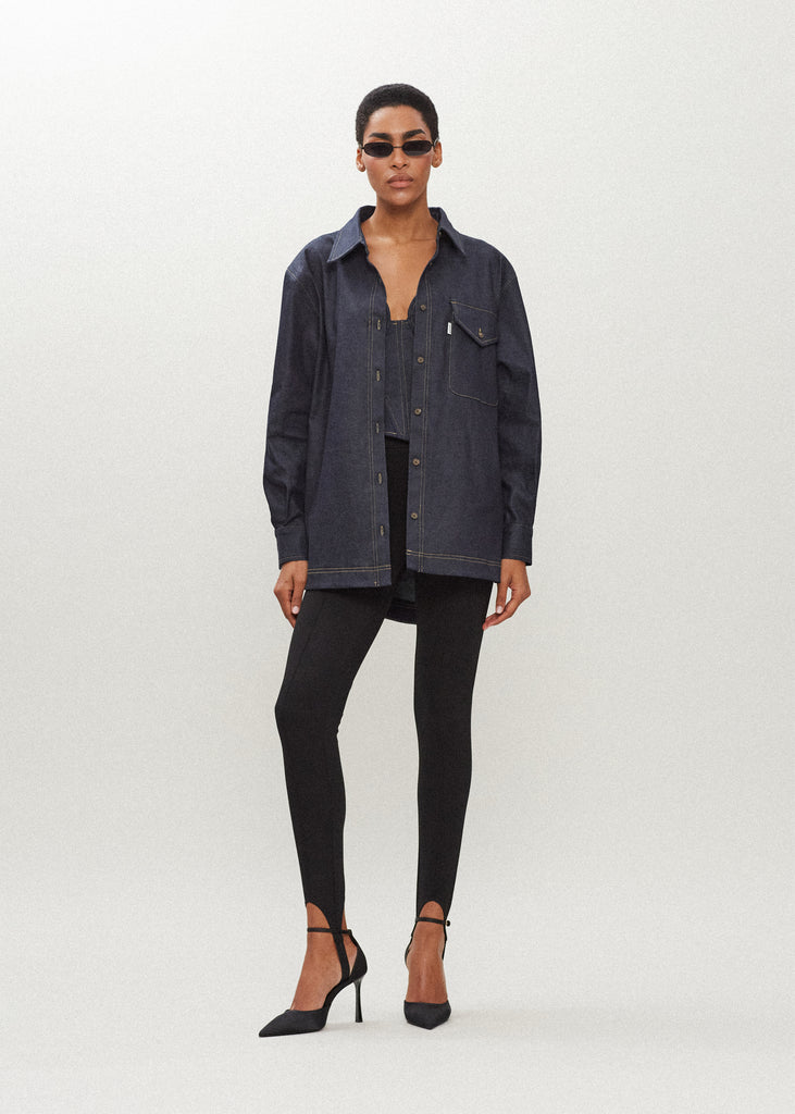 Raw Indigo Charlie Shirt This oversized button down is crafted from lightweight denim for a drapey yet structured silhouette. Its relaxed fit is finished with traditional denim stitching and horn buttons. Features a RŌARI branded deco label at chest pocket.