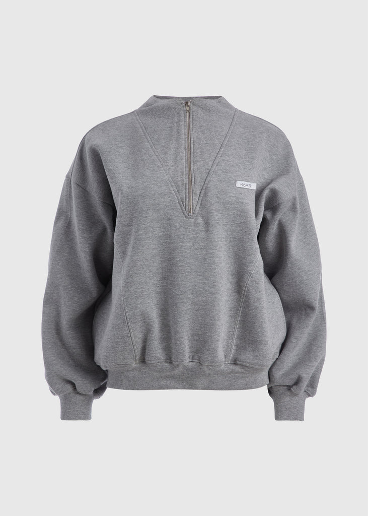 Heather Grey Henry Sweatshirt This half-zip pullover features a ribbed v-neckline, branded patch logo and side pockets. 