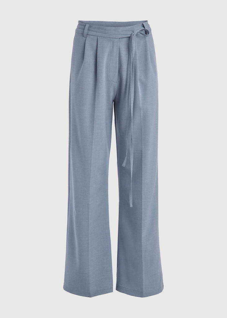 Stone Blue Kat Trouser Dual pleated mid-rise trousers featuring a straight, relaxed fit. Pockets at back with horn buttons. Includes a self-fabric detachable belt. *Sale merchandise is exchangeable for size/color or store credit. 