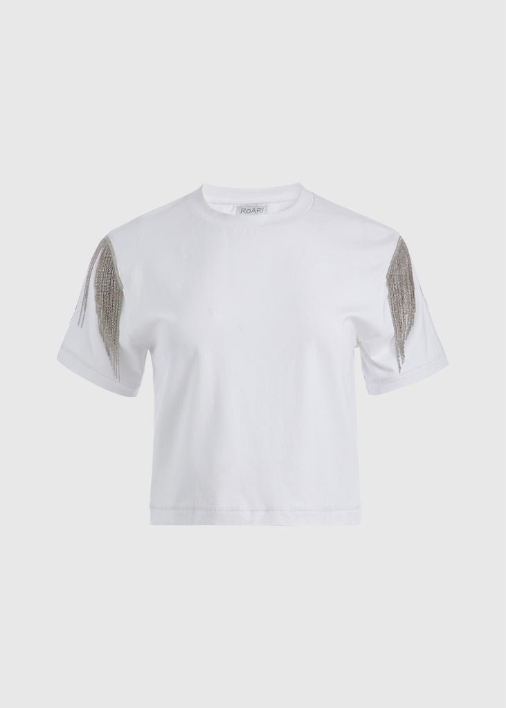 White Liz Tee The Liz Tee is crafted from 100% premium stretch cotton and designed with a boxy cut crewneck for a contemporary look. Hand-applied silver chain fringe detail at the shoulders and a cropped fit that sits perfectly above the hip. FINAL SALE - EXCHANGE OR STORE CREDIT ONLY