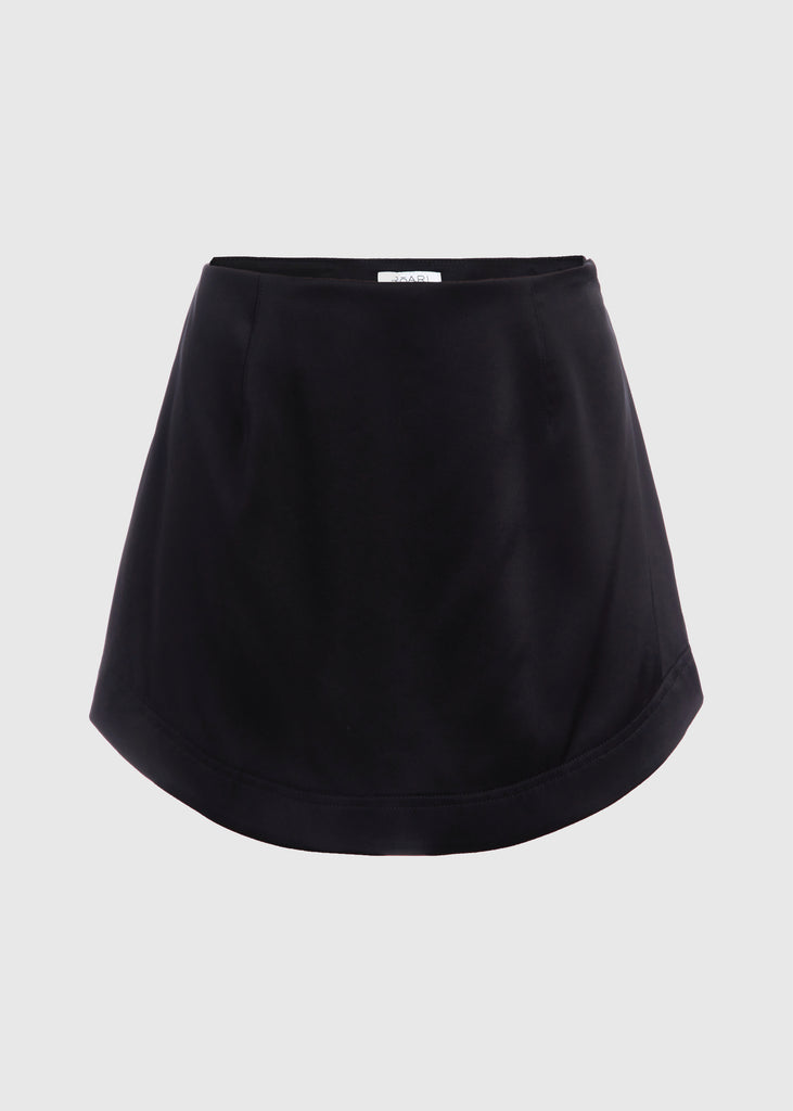 Black Stella Skirt | The Archive This vegan silk mini skirt features a flattering curved front and back. Complete with a concealed side zipper and hook and eye closure. Styled with The Marna Poplin ShirtAll items within The Archive Collection are FINAL SALE.Subscribe to our newsletter to unlock an additional offer exclusive to the archive sale.