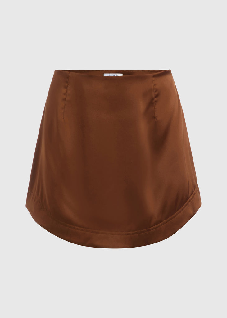 Cinnamon Stella Skirt This vegan silk mini skirt features a flattering curved front and back. Complete with a concealed side zipper and hook and eye closure.  FINAL SALE - EXCHANGE OR STORE CREDIT ONLY